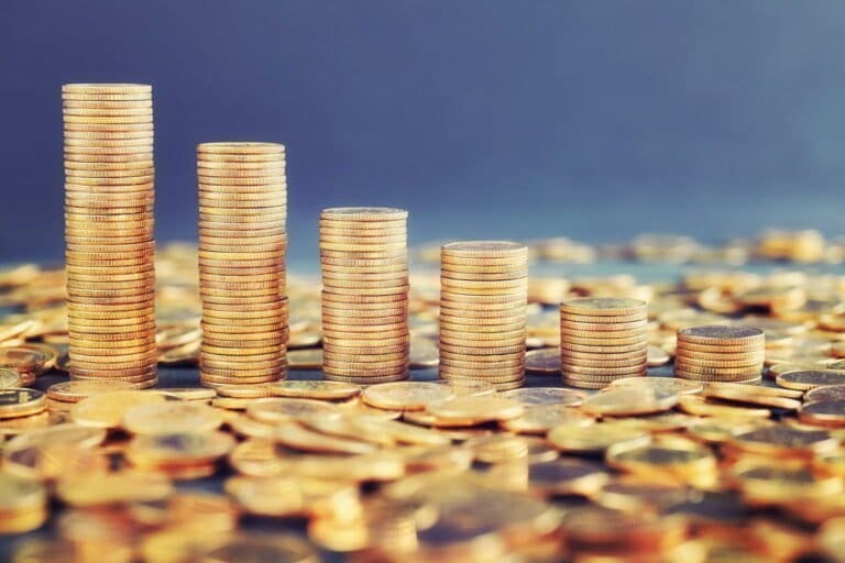 Stacks of golden coins arranged as a chart.